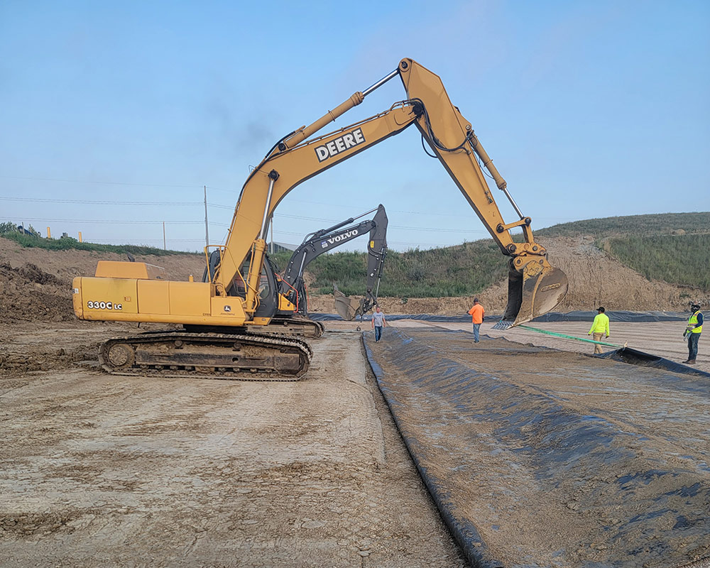 Pulling Geomembrane Back Over Repaired Subgrade