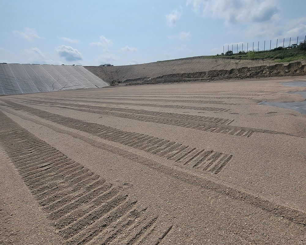 Protective Layer Being Placed on Top of Geomembrane Installation at a Landfill