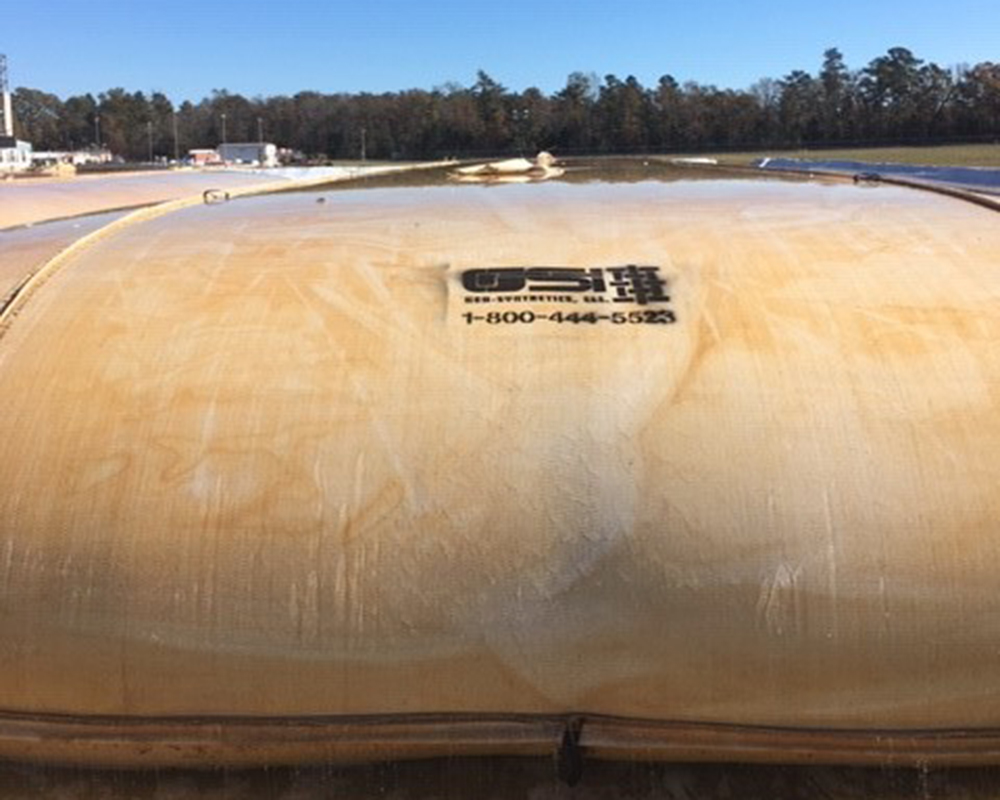 GeoStrux Tube Filled with Dredged Material Undergoing Dewatering and Consolidation