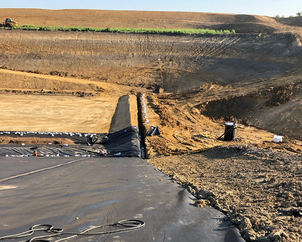 Geomembrane Installation and Anchor Trench in Progress at a Landfill